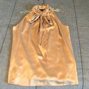 Sleeveless top with bow